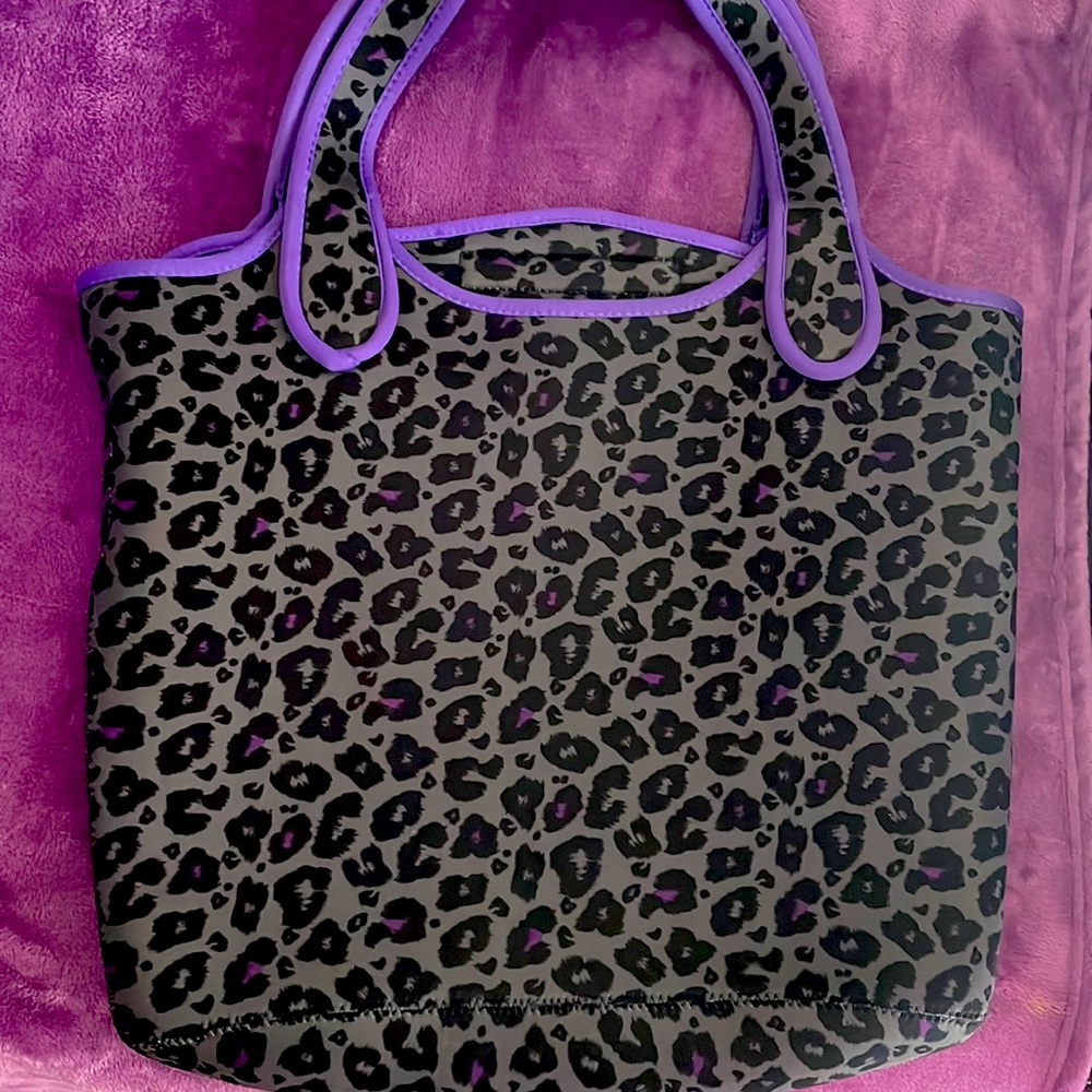 Animal print laptop bag.💜Colors are black gray & purple. No brand name on it.